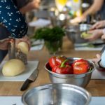 family cooking dinner together in cottage